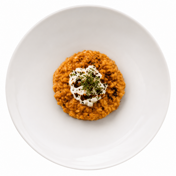Risotto with two kinds of tomatoes, burrata, old balsamic vinegar, basil and olive powder
