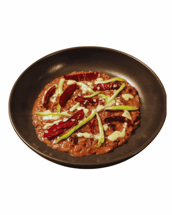 Risotto with Lagrein wine, radicchio, puntarelle, and fresh cheese foam