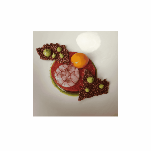 Local beef tartare with buckwheat chips, Sicilian avocado, and radishes