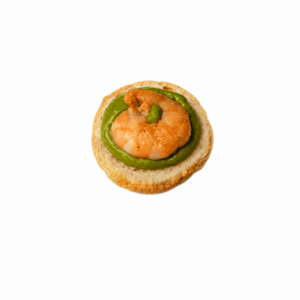 Toasted bread with avocado cream from Sicily and roasted king prawns