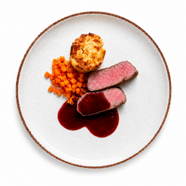 Flat iron steak of local beef with lagrein sauce, potato gratin and braised root vegetables