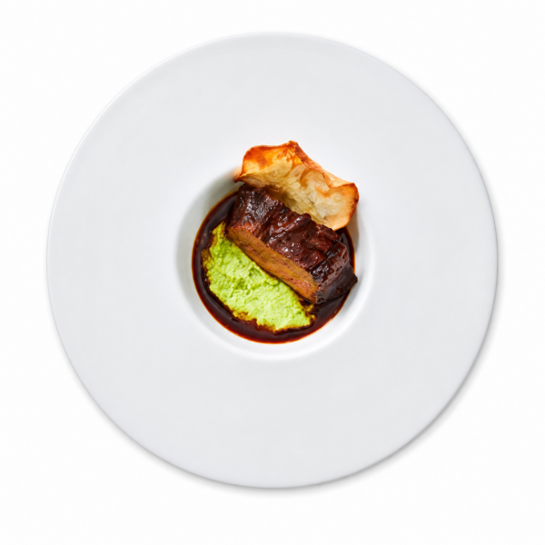 Beef cheek braised in Lagrein sauce with pea purée and glazed carrots