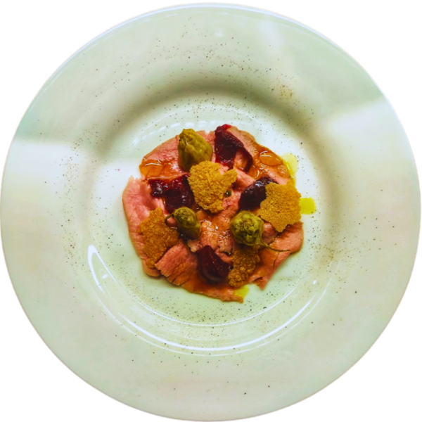 Carpaccio of pink roast beef with puntarelle, red Zwibel confit, Parmesan potato chips and fermented fennel salad