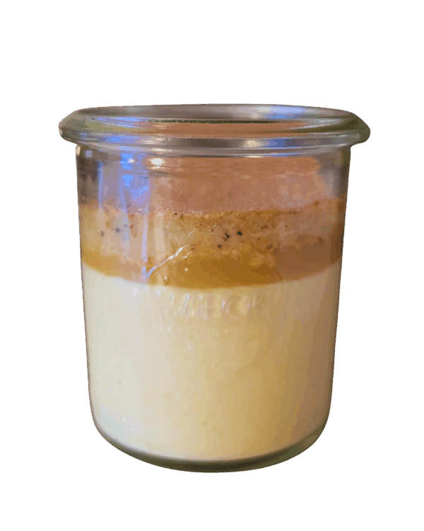 "Muass" in a glass with apple cream, vanilla, semolina cake, and powdered "Scharen"