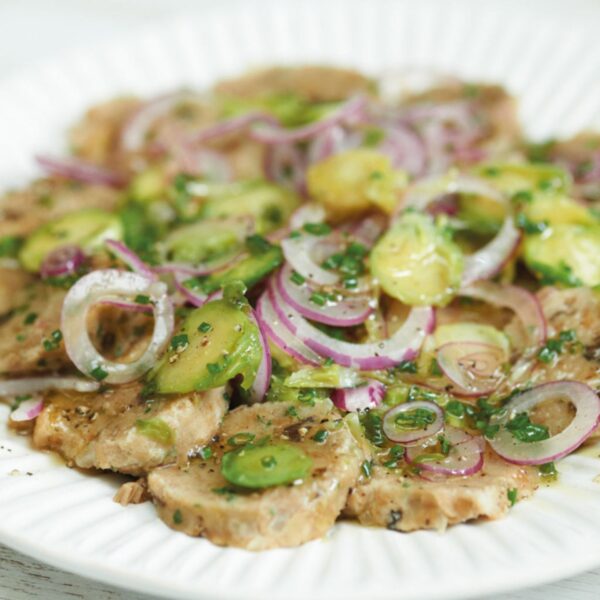 Dumpling salad slices with homemade Tyrolean kimchi and red onion
