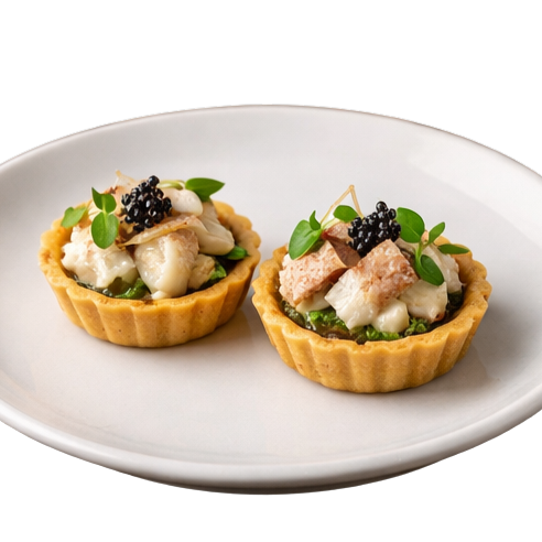 Tartelettes fatte in casa con crema di sedano e pesce gatto affumicato in casa di Bolzano (Almiro Acquaponics)