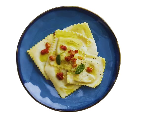 Ravioli alla carbonara mit geröstetem Guanciale auf Parmesanfonduta